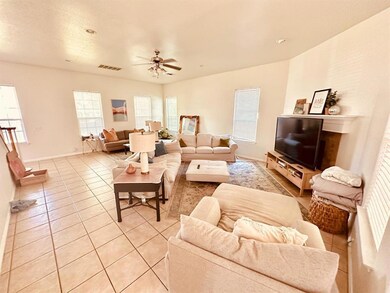 Living room featuring light tile patterned floori