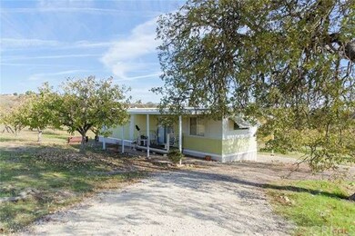 Earlier model mobile home included in sale at no c