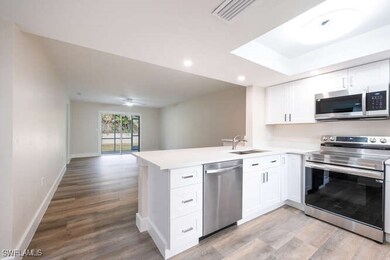 Kitchen with sink, light hardwood / wood-style flo