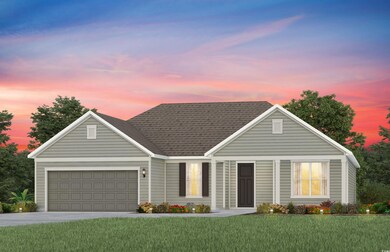 View of front of home with a garage and a lawn