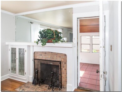 Charming fireplace with Moravian Tile and leaded g