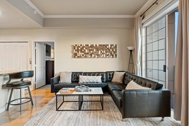 Living area with light wood-style flooring and orn