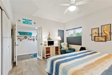 Large bedroom with window to let in lots of natura