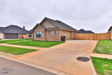 View of front of home featuring a front lawn and a