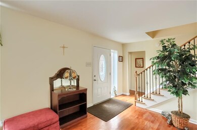 Entry and stair case  &gleaming hardwood floors