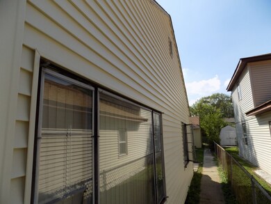 North Side View Walk-Way to Garage and Rear Fenced