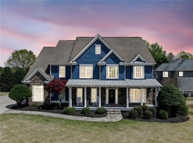 View of front of property featuring stone siding, 
