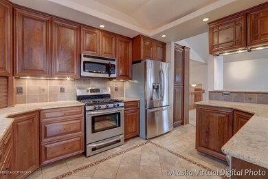 Exquisite cherry cabinetry w/ stainless