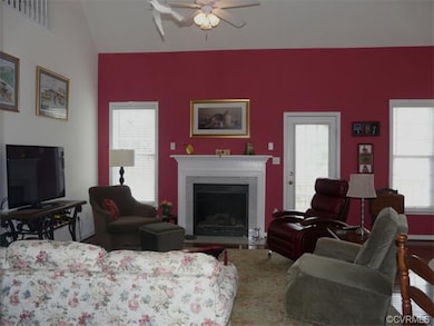 Family room with high ceilings, gas logs and opens