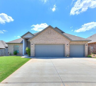 Ranch-style house with a garage and a front yard