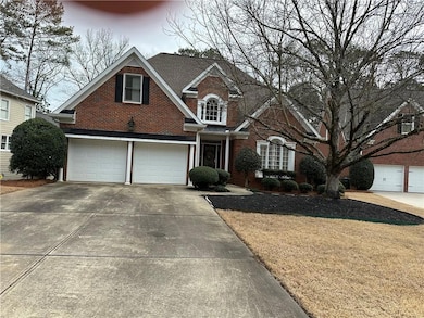 View of property with a garage