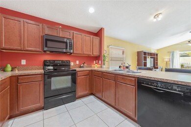 KITCHEN open to FAMILY ROOM.