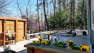 Wooden terrace featuring outdoor dining space