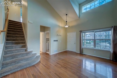 Foyer with stairway, hardwood / wood-style floorin