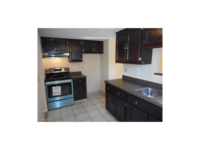 This kitchen features plenty of cabinets and count