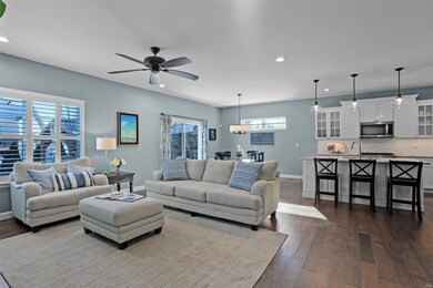 Living room is open to dining room and kitchen.