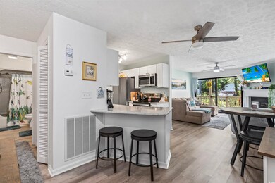 Kitchen featuring white cabinets, kitchen peninsul