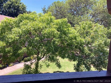 Trees by balcony provide privacy and color