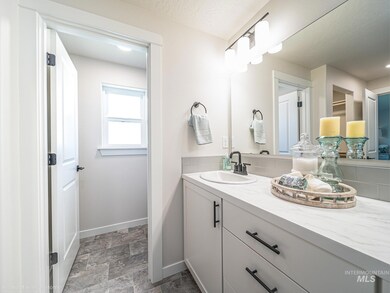 Bathroom featuring vanity and stone finish floors
