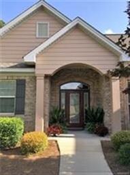 Beautiful columned entryway and leaded glass door!