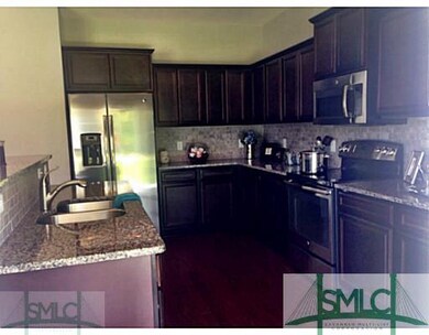 Kitchen. Granite and Stainless. Music Port speaker