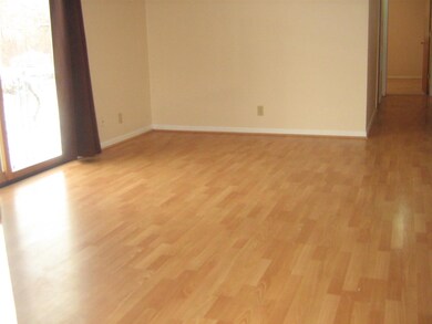 View of living room and hallway leading to bath an