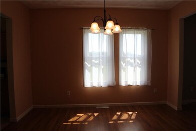 Dining room with new Chandelier and laminate floor
