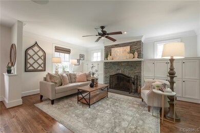 Living room featuring wood-type flooring, plenty o