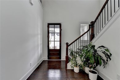 Foyer featuring stairway, plenty of natural light,