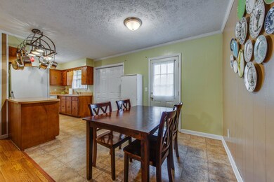 Living room opens to the eat in kitchen area with a door for back yard access.