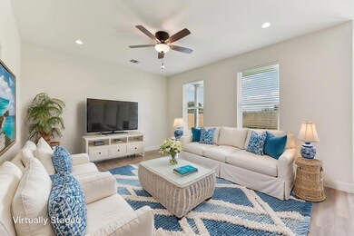 Living area with wood finished floors, visible ve