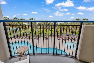 Balcony with view of pool area