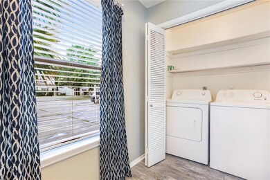 Laundry closet near the kitchen, washer and dryer