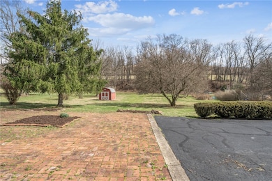 REAR PATIO AND BEAUTIFUL YARD