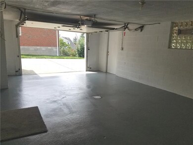 The oversized 1 car garage under the addition with