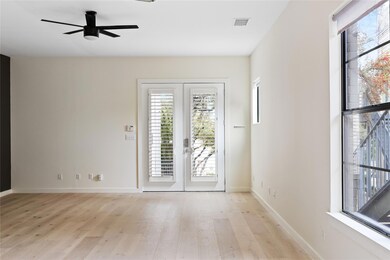 Empty room with plenty of natural light, french d