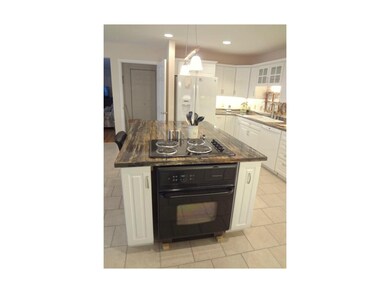 Nice and bright with miles of cabinets and workspa