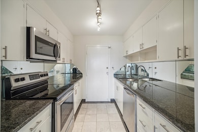 The kitchen features stainless appliances.