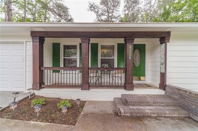 Doorway to property with covered porch