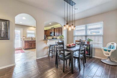 Large Dining Room with wood-look ceramic tile and