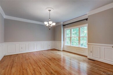 Dining room - note the medallion on chandelier!  And those floors!!