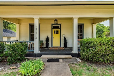 Doorway to property featuring a porch