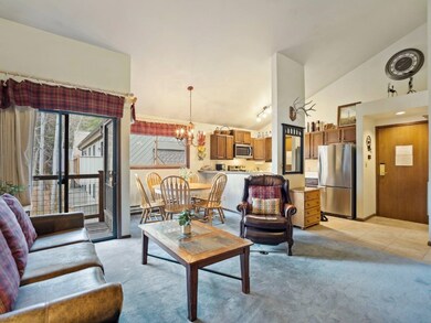 Living room with vaulted ceiling, a notable chande