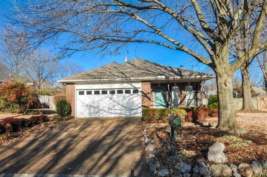This home features a 2-car garage, a covered porch