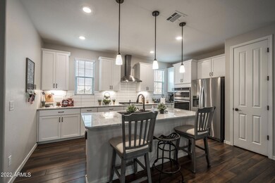 White Gourmet kitchen w stainless