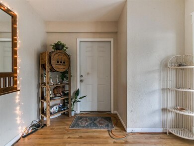Foyer entrance with light hardwood / wood-style fl