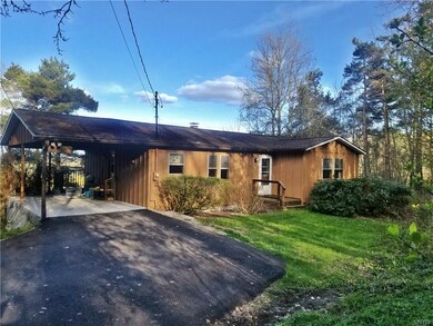 Front of the house,carport and paved driveweay