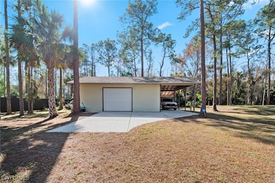 Garage featuring a yard