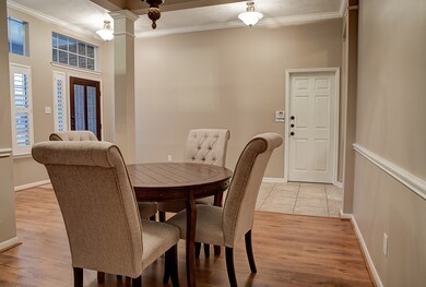 The garage entry is opposite of the dining room, f
