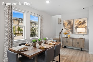 Dining space with light wood-type flooring